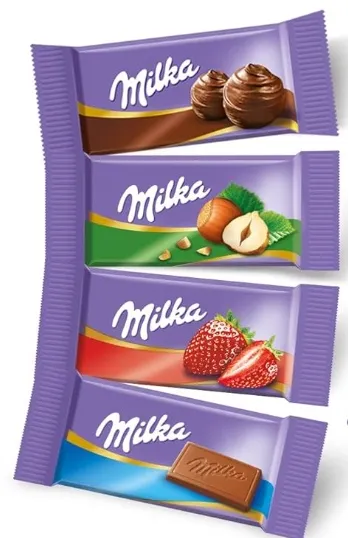 4 forskellige Milka smage: Alpemælk, kakaocreme, jordbær og hasselnød.